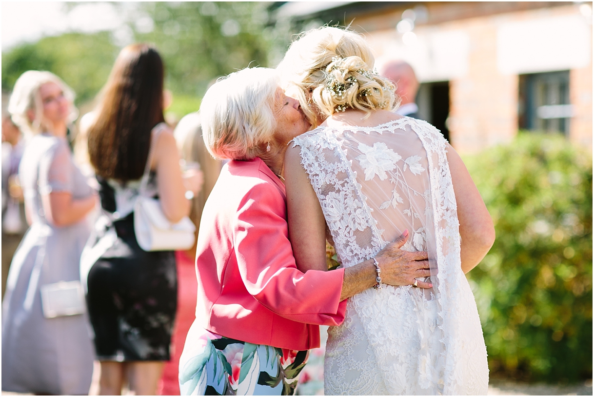Granny kissing bride