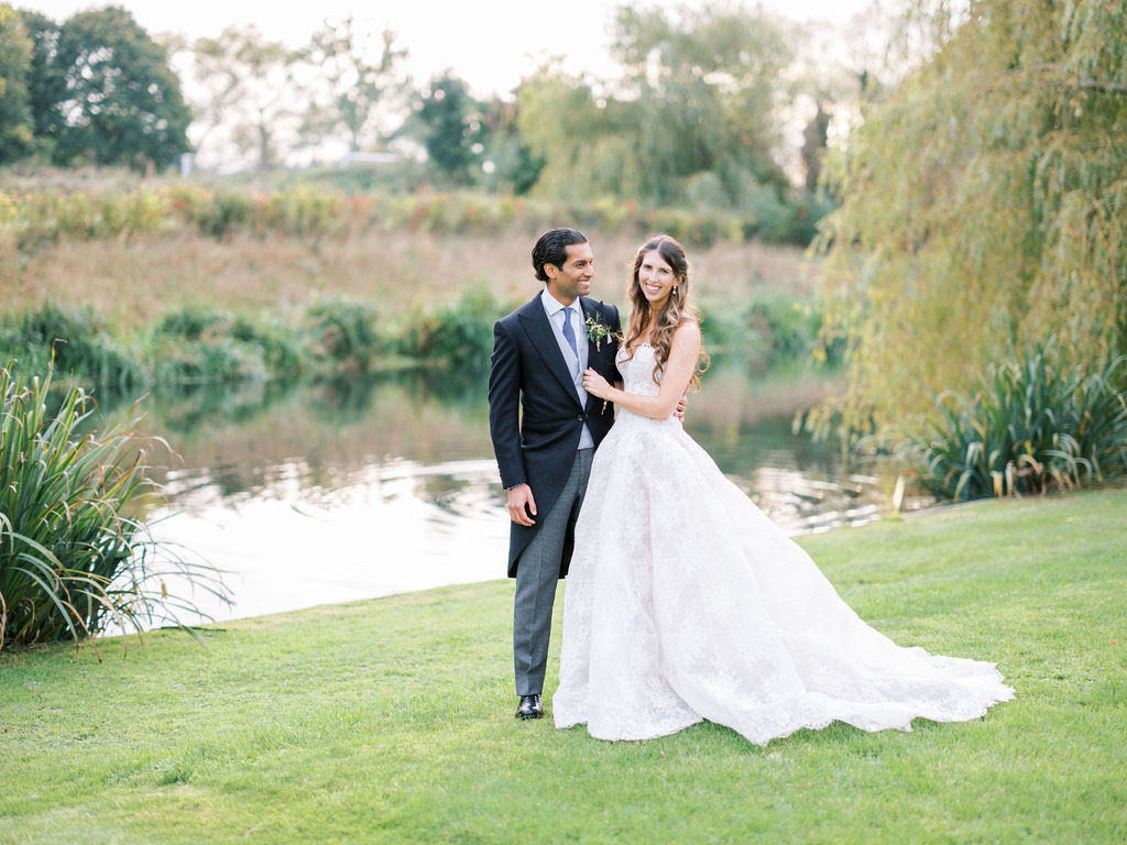 Romantic couple photographs by the lake at Ardington House wedding